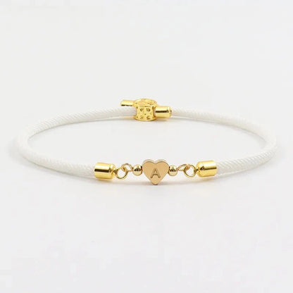 Pulseras ajustables con corazón e inicial