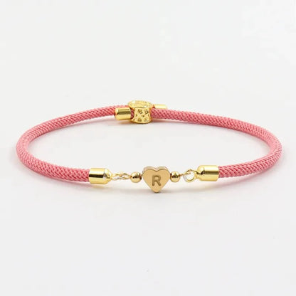 Pulseras ajustables con corazón e inicial