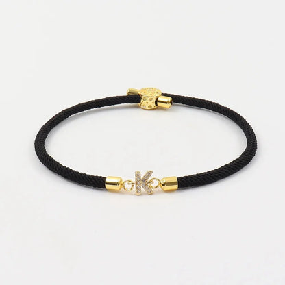 Pulseras ajustables con inicial